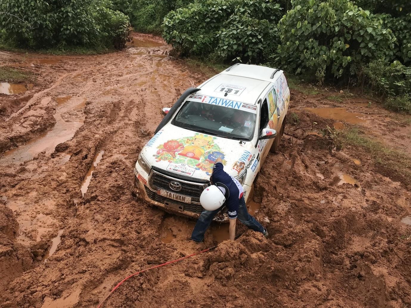 A series of rainstorms makes the rugged road even more dangerous than before.